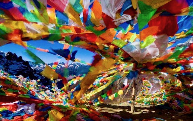 Prayer flags over Tibetan mountains
