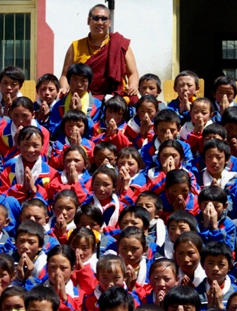 Rinpoche with Tibetan schoolchildren in uniform